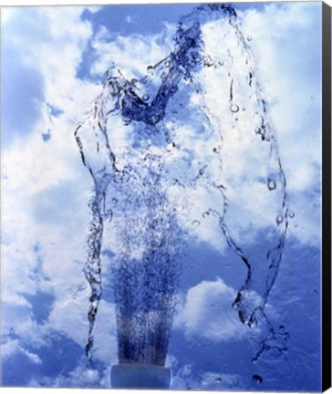 Framed Slow motion geyser of water rising through blue sky and clouds Print