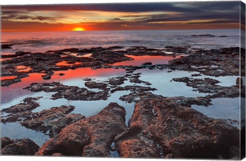 Framed Tidal pools reflect the sunrise colors during the autumn equinox Print