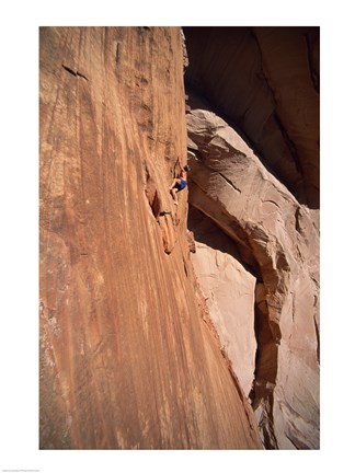 Framed Low angle view of a man climbing a mountain, Utah, USA Print