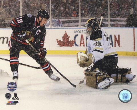 Framed Jonathan Toews 2014 NHL Stadium Series Action Print