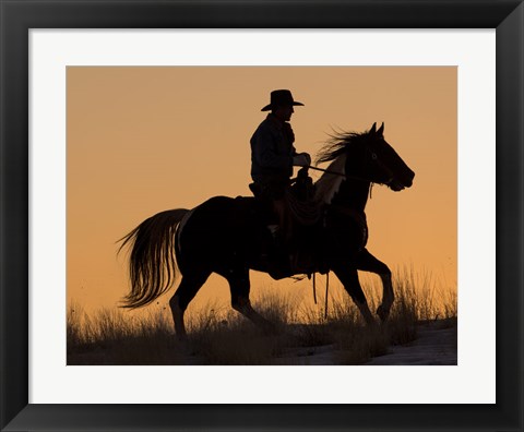 Framed Cowboy Riding His Horse Winters Snow Silhouetted At Sunset Print