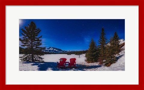 Framed Red Chairs Under a Moonlit Winter Sky at Two Jack Lake Print
