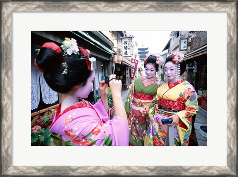 Framed Three geishas, Kyoto, Honshu, Japan (taking pictures) Print