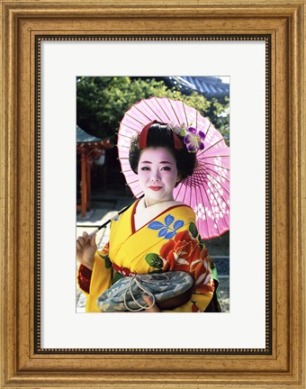 Framed Geisha holding a parasol, Kyoto, Japan Print