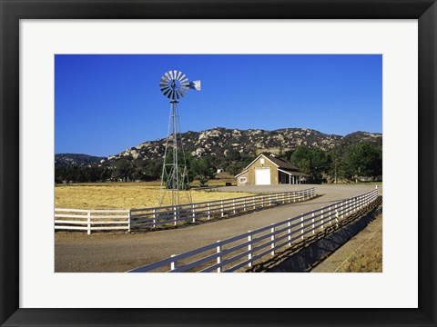 Framed Industrial windmill on a farm, California, USA Print