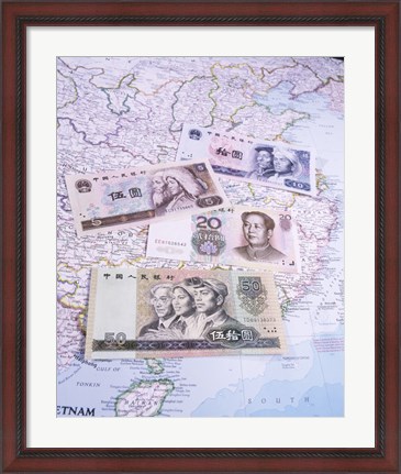 Framed Close-up of yuan notes on a map Print