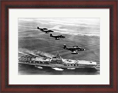 Framed High angle view of four fighter planes flying over an aircraft carrier, US Navy Banshees, USS Coral Sea (CV-43) Print