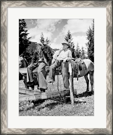 Framed Teenage cowboys sitting on rail fence Print