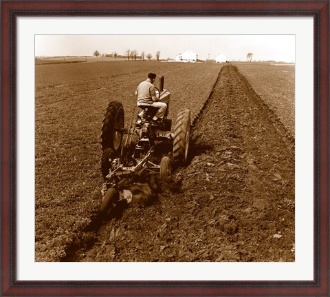Framed USA, Pennsylvania, Farmer on Tractor Plowing Field Print