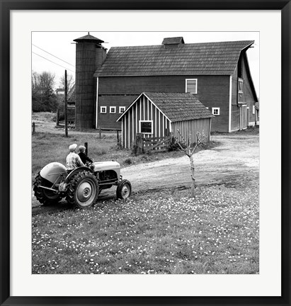 Framed Man with a Boy Riding a Tractor in a Field Print