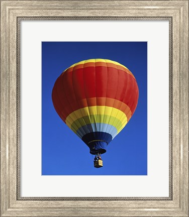 Framed Low angle view of a hot air balloon rising, Albuquerque International Balloon Fiesta, Albuquerque, New Mexico, USA Print