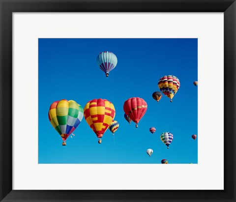 Framed Low angle view of a group of hot air balloons in the sky Print