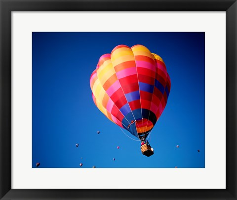 Framed Lone Hot Air Balloon with Other Hot Air Balloons in the Distance Print