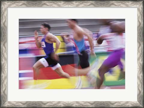 Framed Side profile of three men running on a running track Print