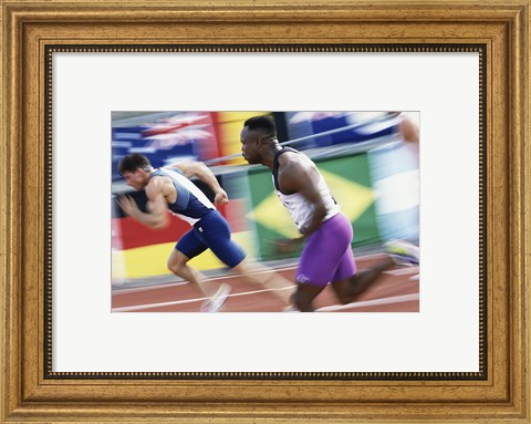 Framed Side profile of two young men running on a running track Print