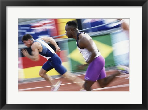 Framed Side profile of two young men running on a running track Print