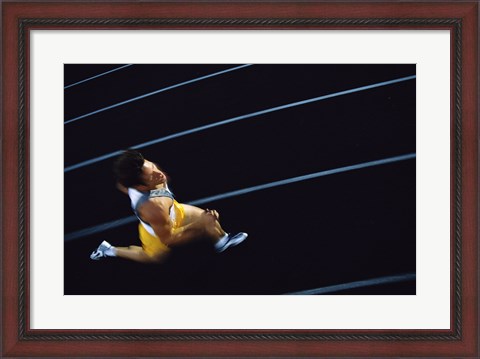 Framed High angle view of a young man running on a running track Print