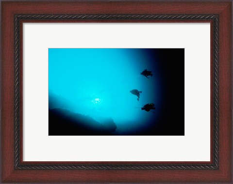 Framed Three scuba divers swimming underwater, Blue Hole, Belize Print
