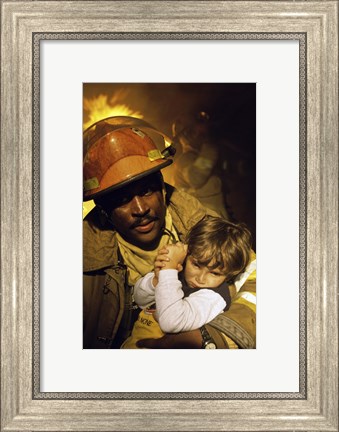 Framed Firefighter carrying a boy Print