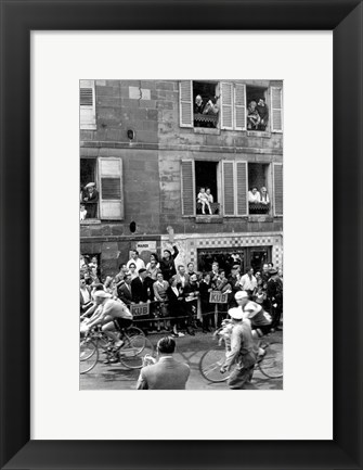 Framed People watching the cyclists being provisioned. Tour de France 1958. Print