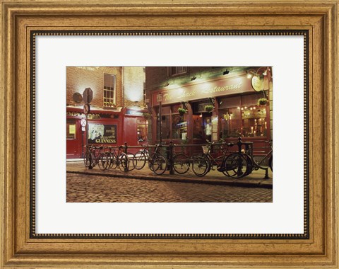 Framed Bicycles parked in front of a restaurant at night, Dublin, Ireland Print