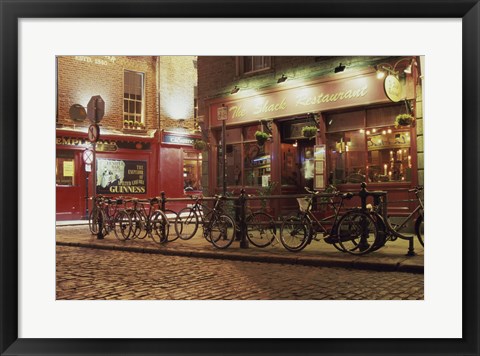 Framed Bicycles parked in front of a restaurant at night, Dublin, Ireland Print