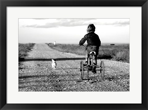 Framed Rear view of a girl riding a bicycle Print