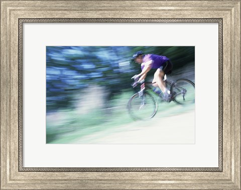 Framed Side profile of a young man riding a bicycle Print
