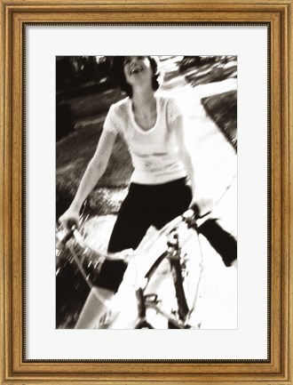 Framed Young woman riding a bicycle - black &amp; white Print