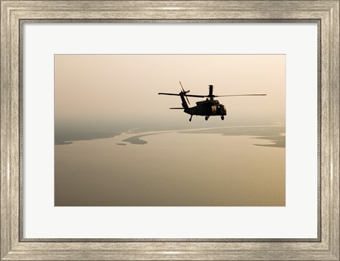 Framed Air Force helicopter flys over Lake Pontchatrain to New Orleans Print