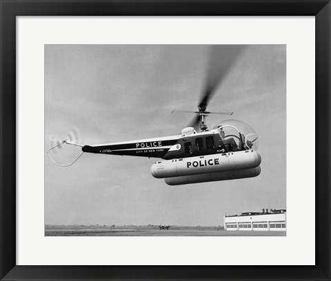Framed Low angle view of a helicopter in flight, Bell 47-D, Bell Aircraft Corporation Print