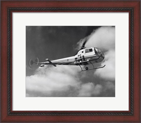 Framed Low angle view of a helicopter in flight in the sky, Bell Helicopter Print