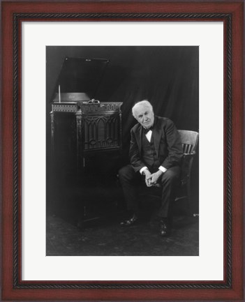 Framed Thomas Edison, seated beside phonograph Print