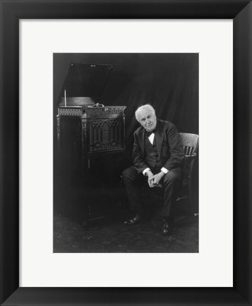Framed Thomas Edison, seated beside phonograph Print