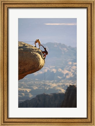 Framed Two hikers with ropes at the edge of a cliff 2 Print