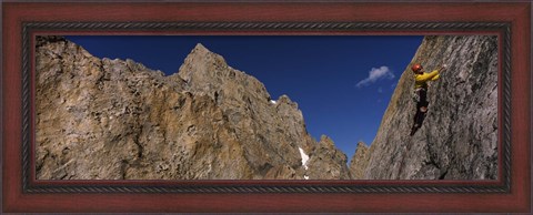 Framed Man climbing up a mountain, Grand Teton, Grand Teton National Park, Wyoming, USA Print