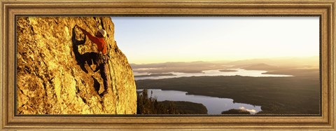 Framed Man climbing up a mountain, Rockchuck Peak, Grand Teton National Park, Wyoming, USA Print