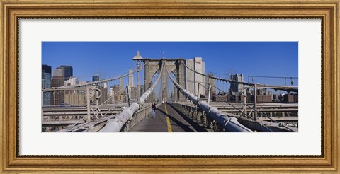 Framed Rear view of a woman walking on a bridge, Brooklyn Bridge, Manhattan, New York City, New York State, USA Print