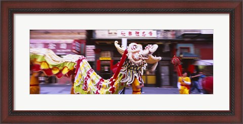 Framed Group of people performing dragon dancing on a road, Chinatown, San Francisco, California, USA Print