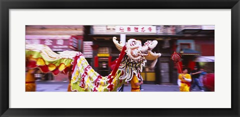 Framed Group of people performing dragon dancing on a road, Chinatown, San Francisco, California, USA Print