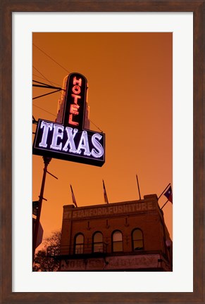 Framed Low angle view of a neon sign of a hotel lit up at dusk, Fort Worth Stockyards, Fort Worth, Texas, USA Print