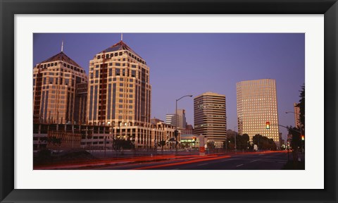 Framed USA, California, Oakland, Alameda County, New City Center, Buildings lit up at night Print