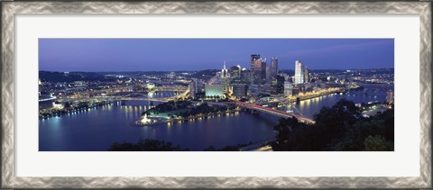 Framed Buildings along a river lit up at dusk, Monongahela River, Pittsburgh, Allegheny County, Pennsylvania, USA Print