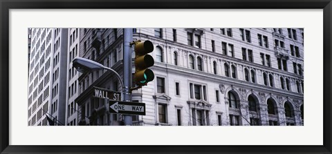 Framed Low angle view of a Green traffic light in front of a building, Wall Street, New York City Print