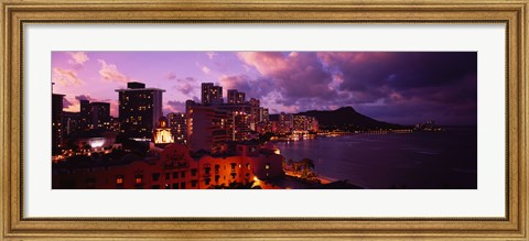 Framed Buildings lit up at dusk, Waikiki, Oahu, Hawaii, USA Print