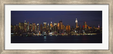 Framed Skyscrapers lit up at night in a city, Manhattan, New York City, New York State, USA Print