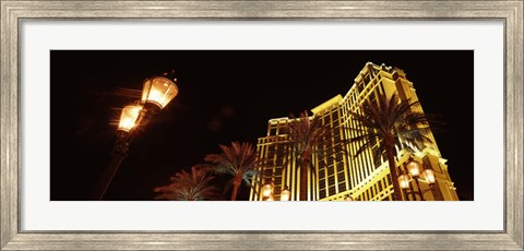 Framed Low angle view of a hotel lit up at night, The Strip, Las Vegas, Nevada, USA Print