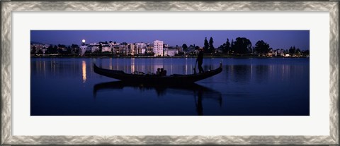 Framed Boat in a lake with city in the background, Lake Merritt, Oakland, Alameda County, California, USA Print