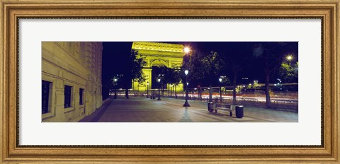 Framed France, Paris, Arc de Triomphe lit up at night Print