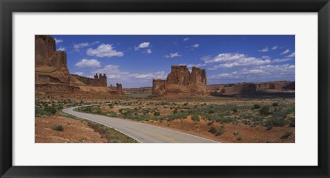 Framed Empty road running through a national park, Arches National Park, Utah, USA Print